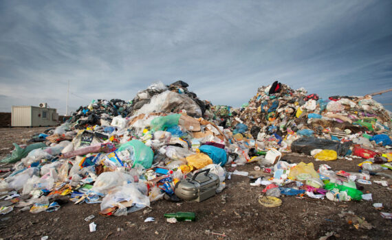 Pile of waste at city landfill. Waste management, ecology concept